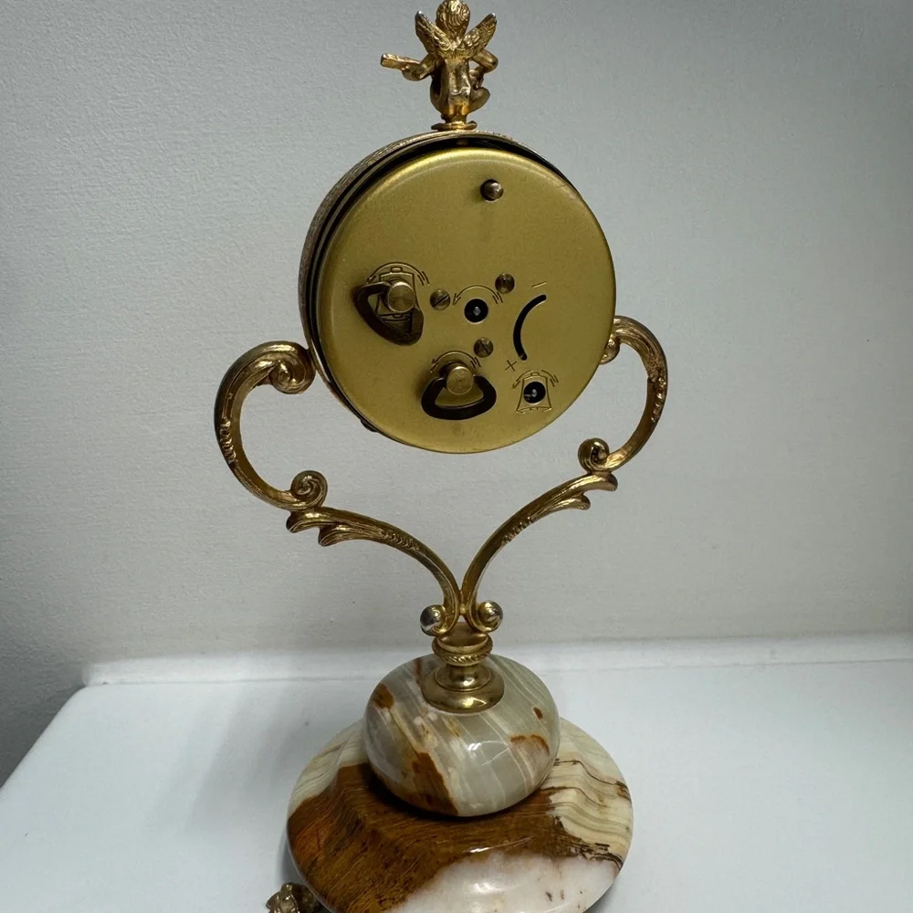 Vintage “Ritz” cherub mantel/desk clock with a brass-tone frame and an onyx